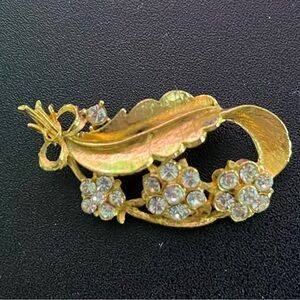 Rhinestone decorative gold tone brooch - 2”